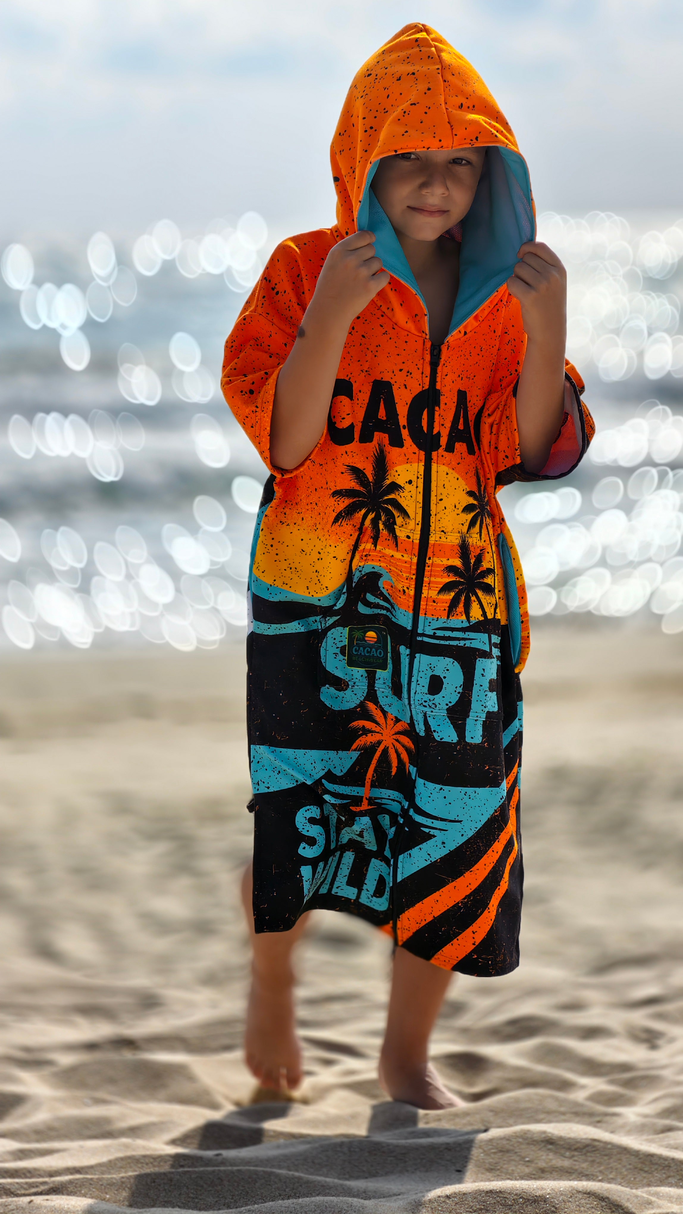 Orange children’s beach poncho towel with hood, zipper and pockets – CACAO Beachwear™