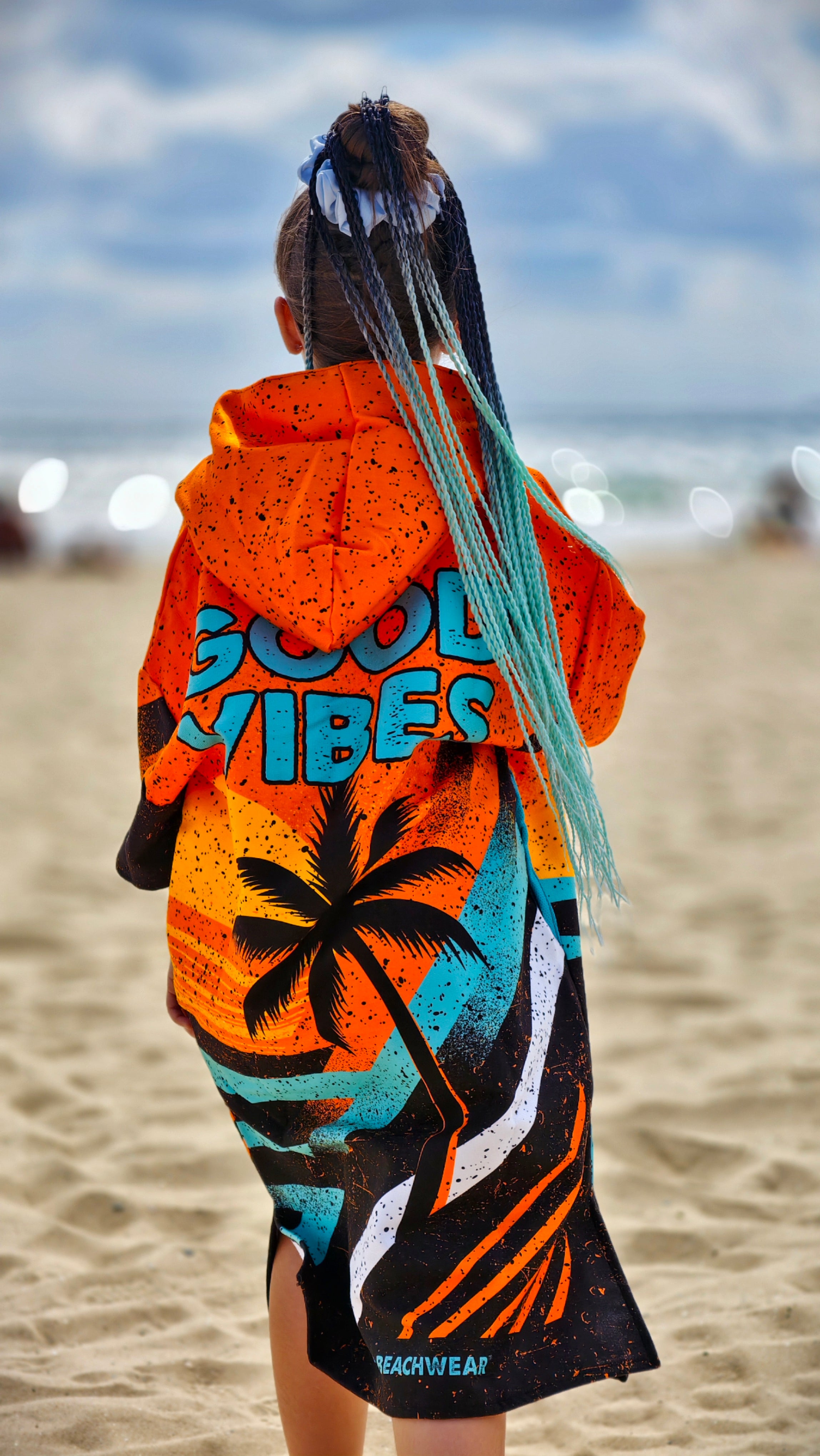 Orange children’s beach poncho towel with hood, zipper and pockets – CACAO Beachwear™