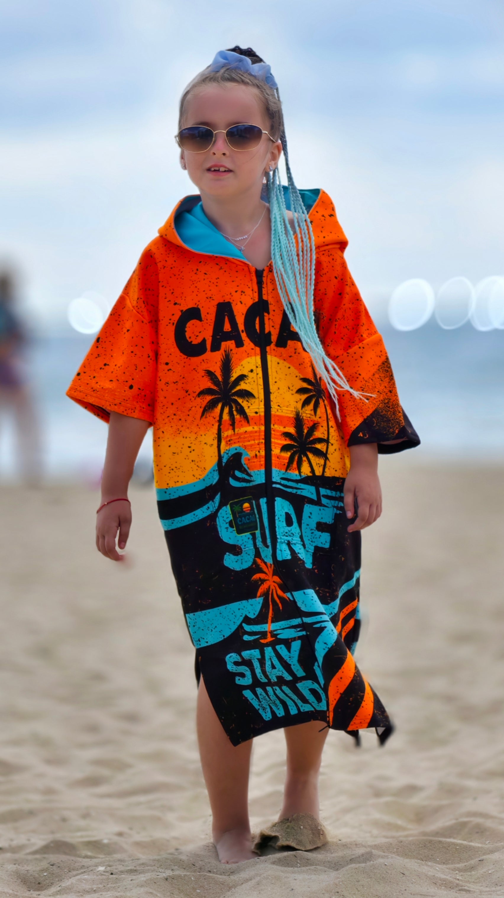 Orange children’s beach poncho towel with hood, zipper and pockets – CACAO Beachwear™