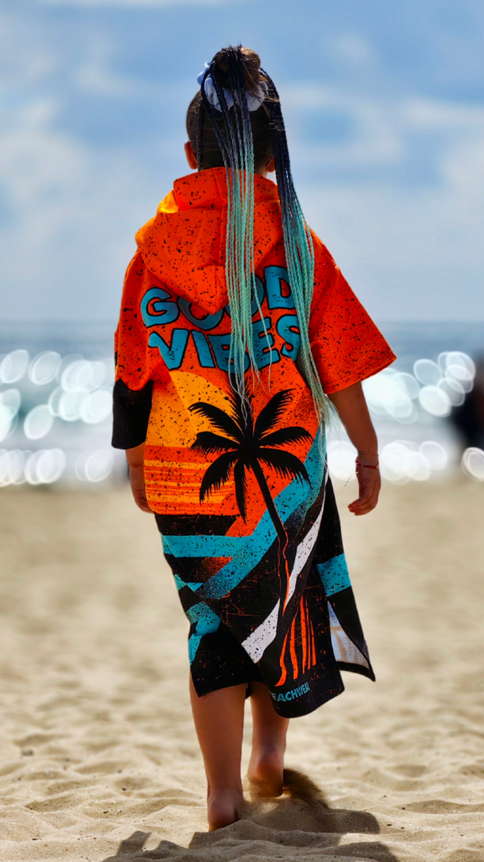 Orange children’s beach poncho towel with hood, zipper and pockets – CACAO Beachwear™