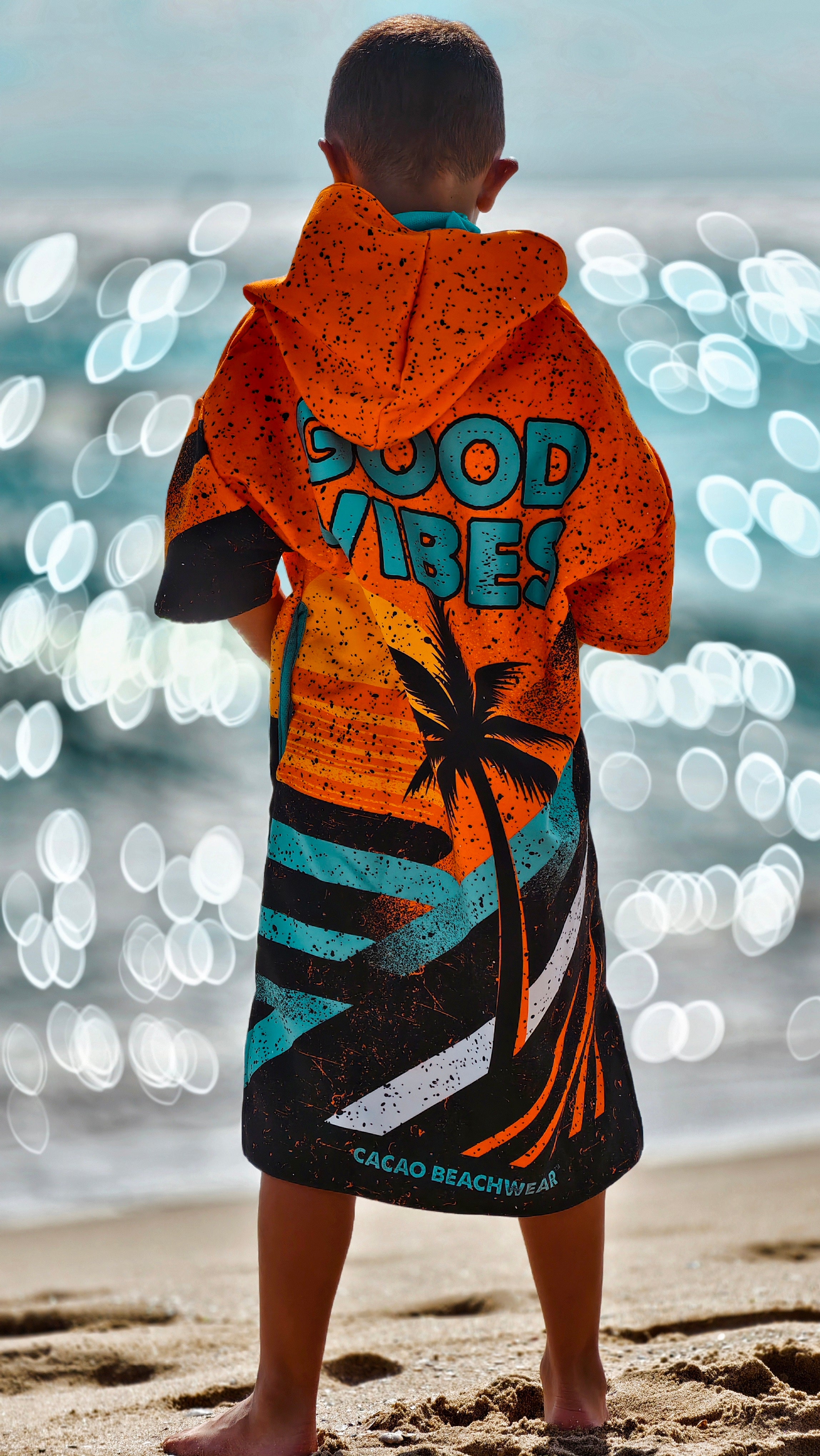 Orange children’s beach poncho towel with hood, zipper and pockets – CACAO Beachwear™