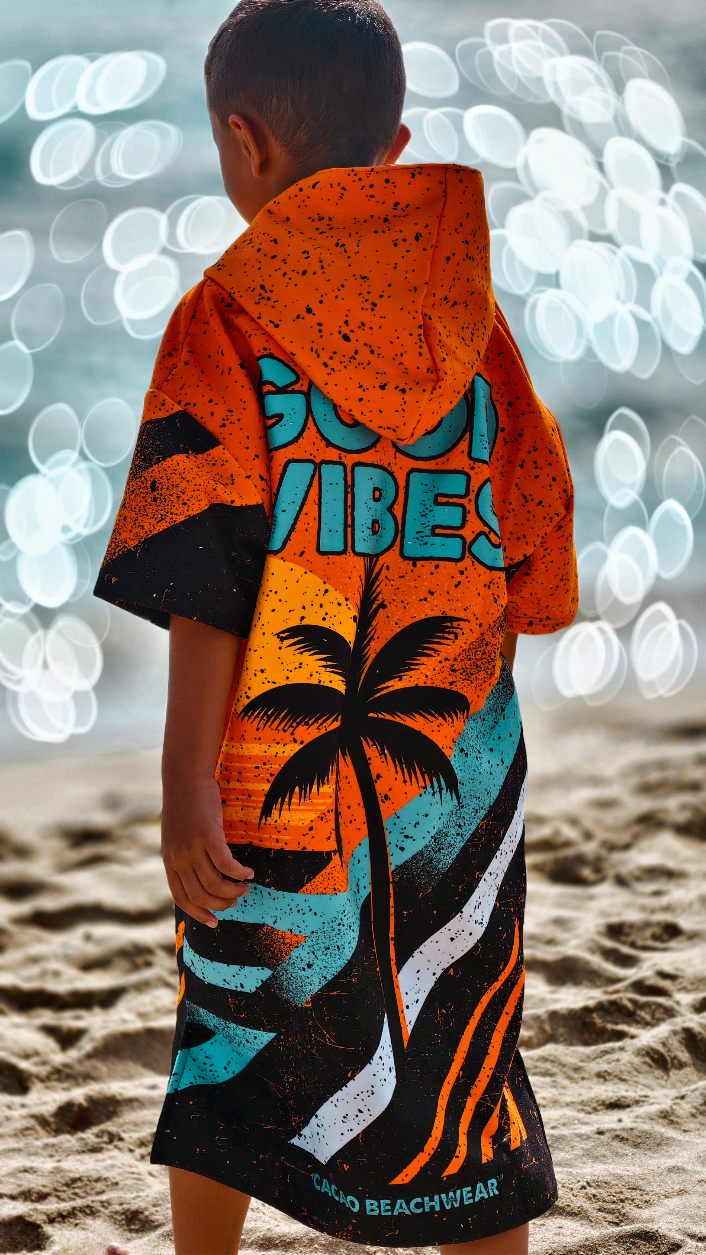 Orange children’s beach poncho towel with hood, zipper and pockets – CACAO Beachwear™
