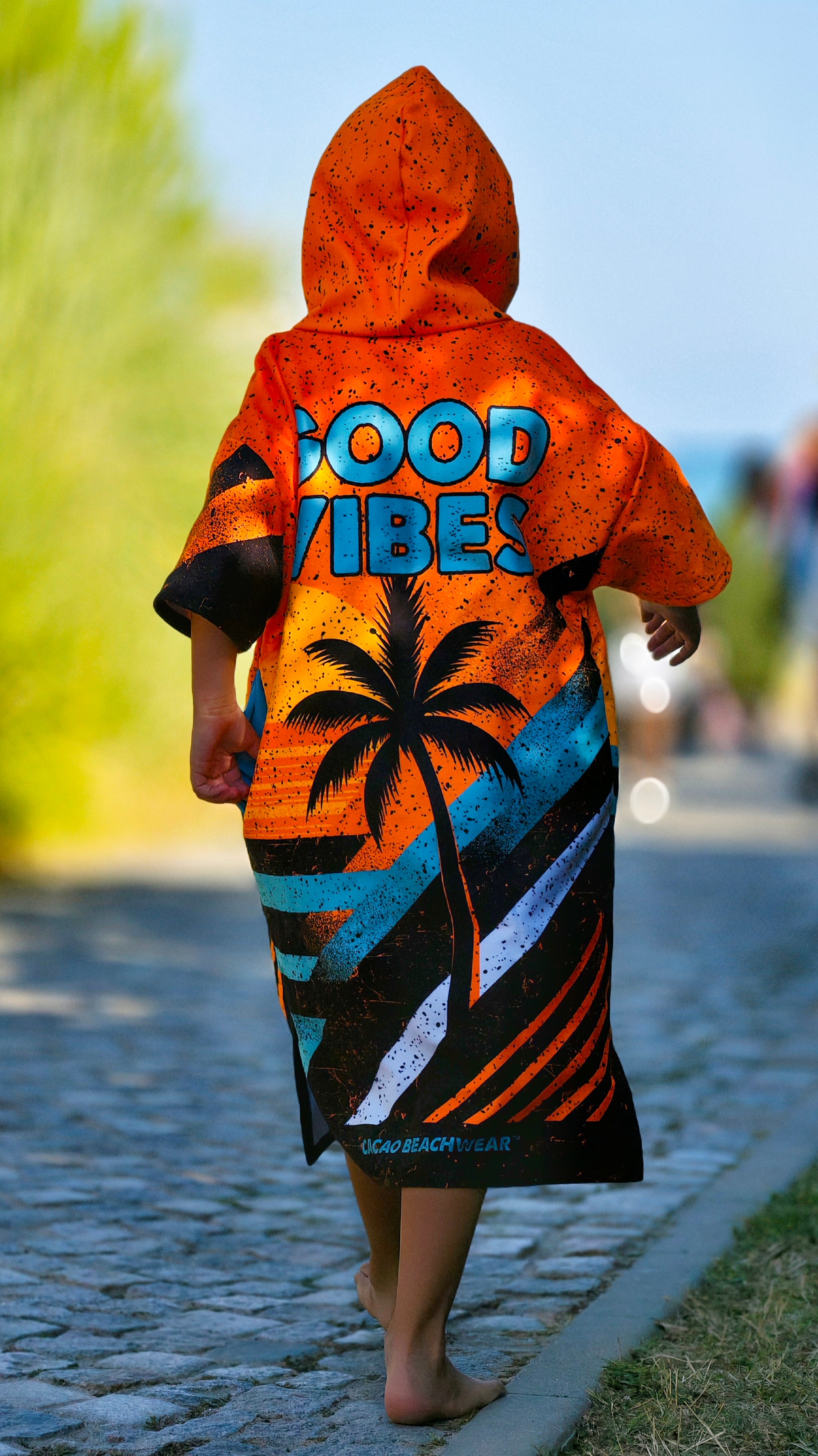 Orange children’s beach poncho towel with hood, zipper and pockets – CACAO Beachwear™