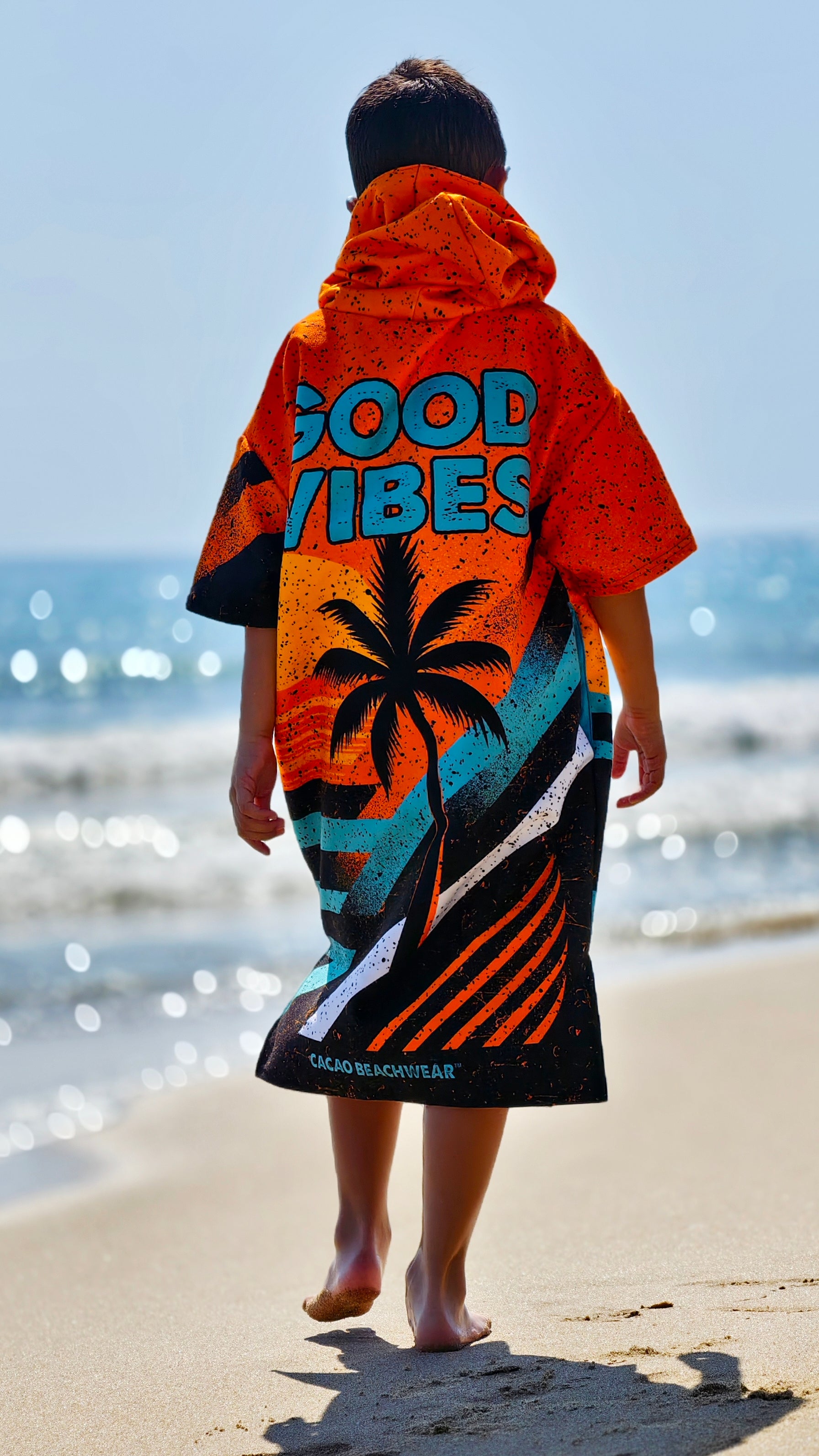 Orange children’s beach poncho towel with hood, zipper and pockets – CACAO Beachwear™