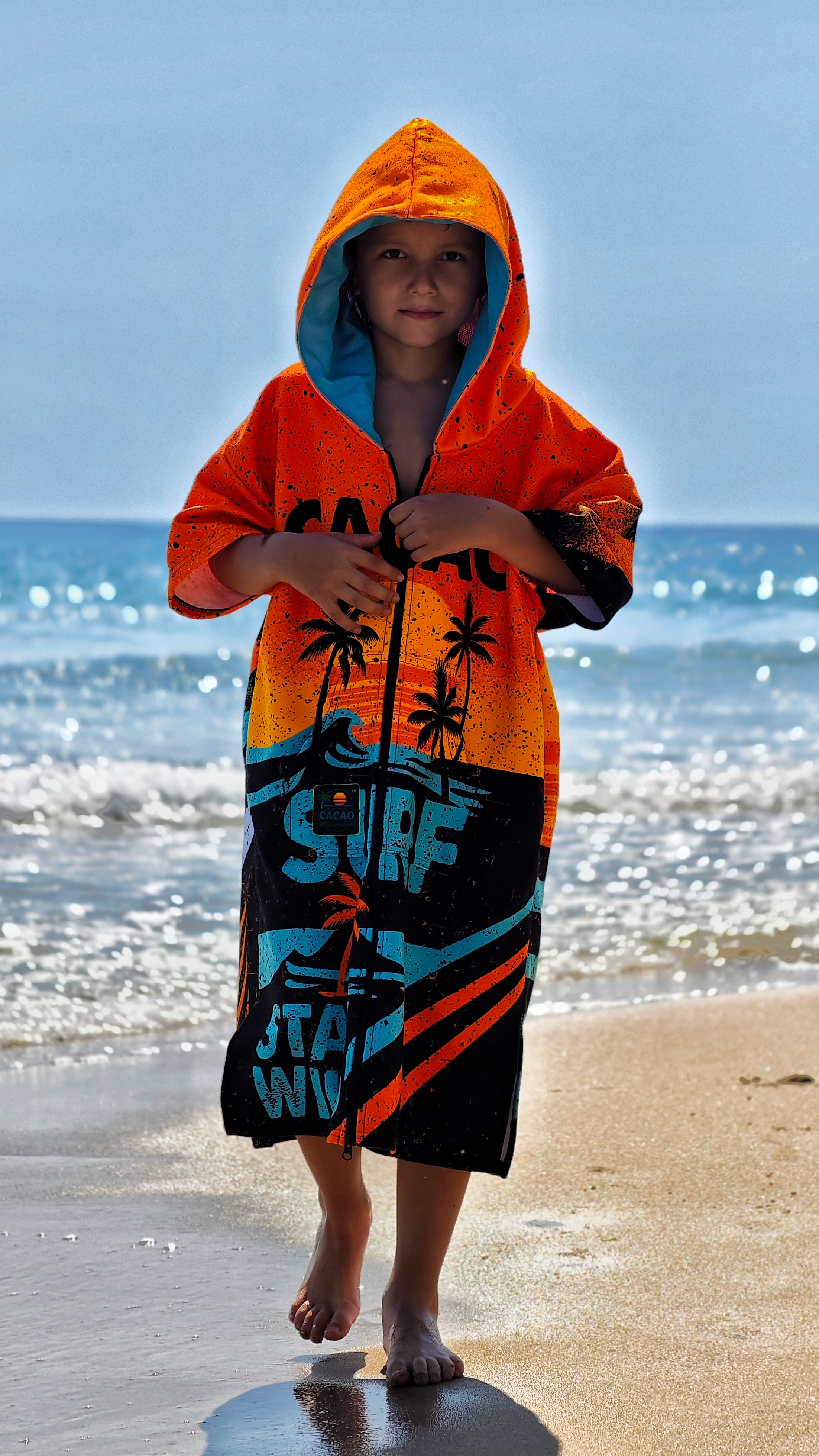 Orange children’s beach poncho towel with hood, zipper and pockets – CACAO Beachwear™