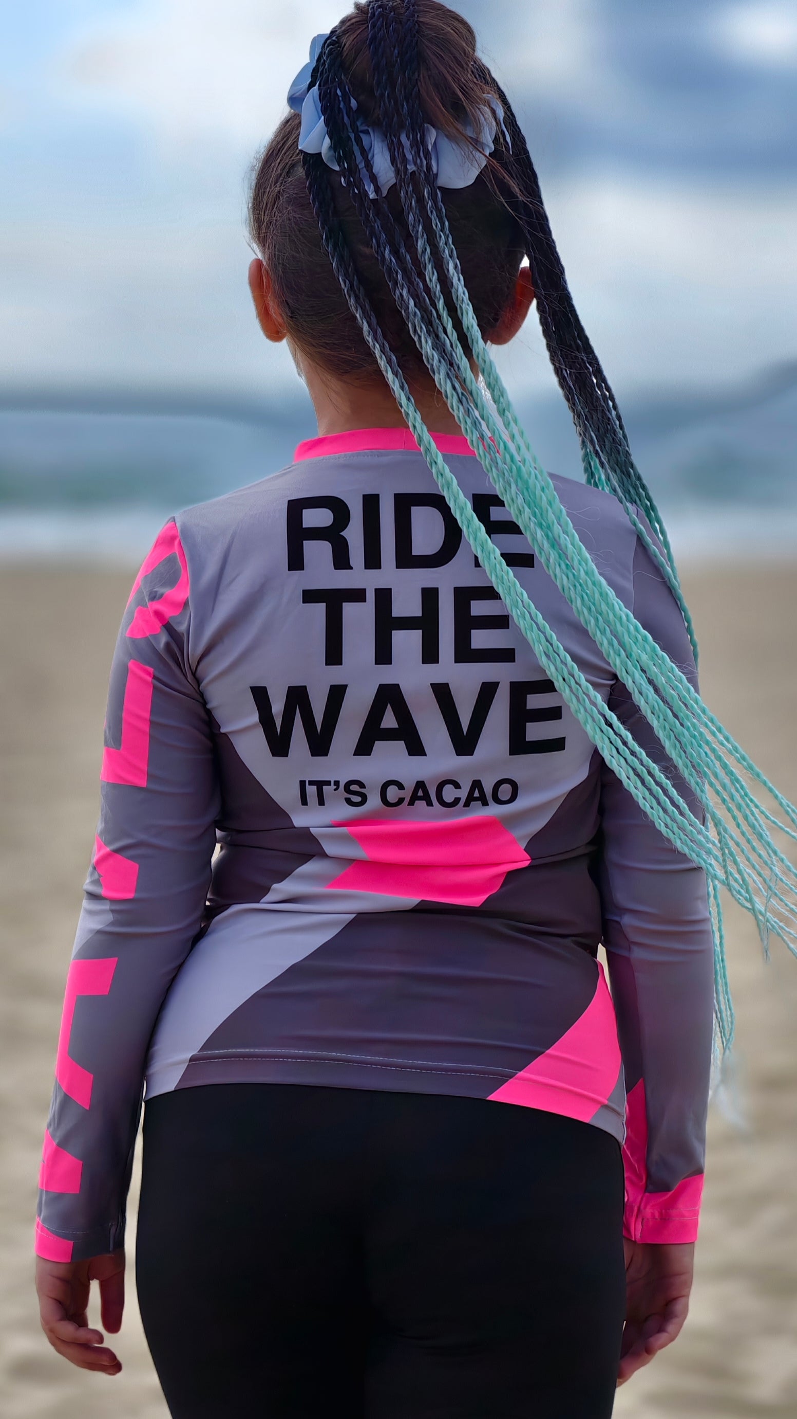 Solar Vibes Pink children’s rashguard CACAO Beachwear™️ with UV Protection
